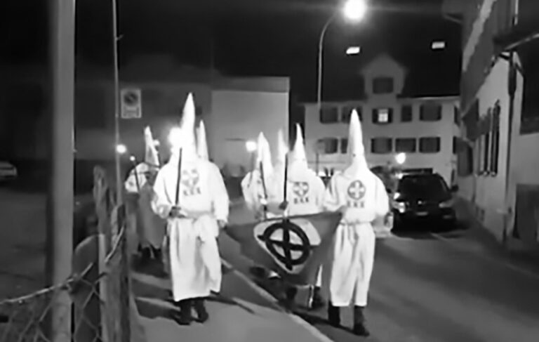 Read more about the article KKK Marchers In White Gowns and Hats Invade Swiss Town