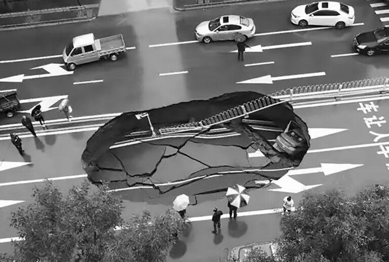Read more about the article Taxi Swallowed By 2,000 Sq Ft Sinkhole In Middle Of Road