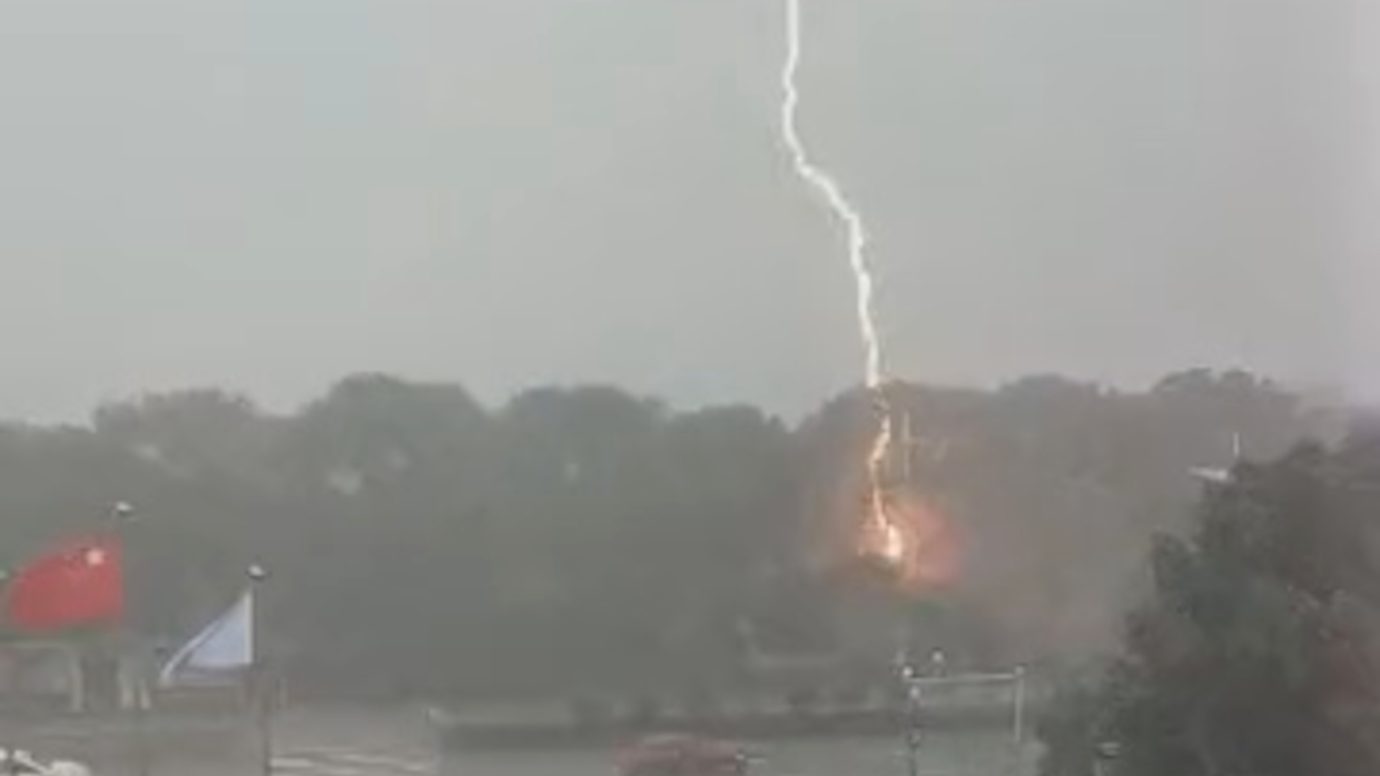 Read more about the article Moment Of Terror As Woman Captures Huge Lightning Bolt Striking Ground As She Opens Window To Film Storm