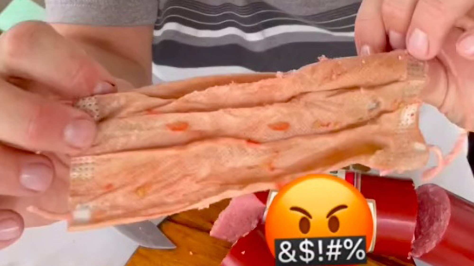 Read more about the article Viral Moment Russian Influencer Finds Face Mask Inside Sausage