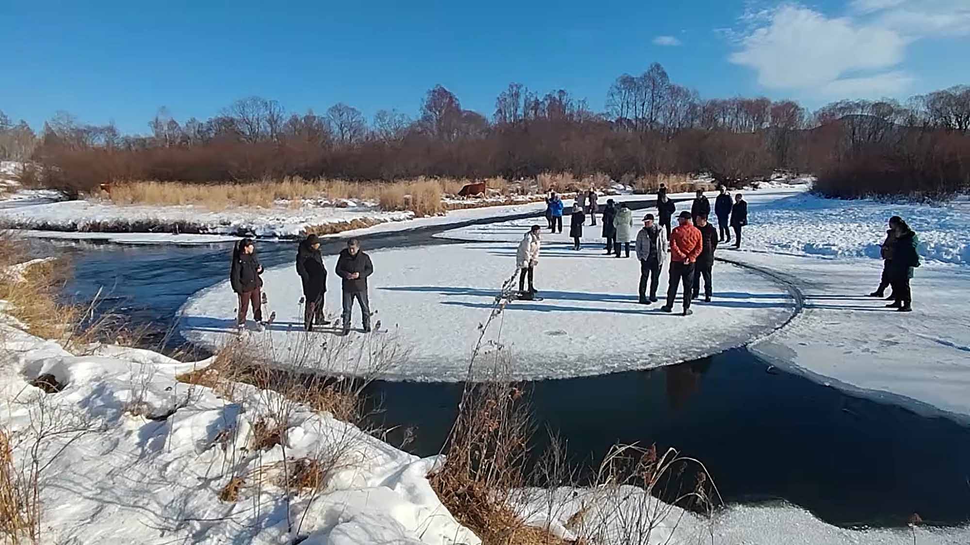 Excited Locals Go For Spin On Giant Ice Circle Formed On Frozen River