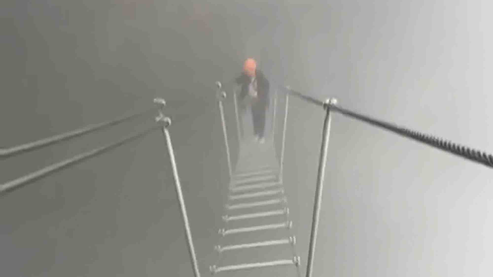 Breathtaking Moment Hikers Cross Misty ‘Ladder To Heaven’ Over Massive Drop